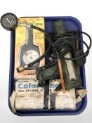 A small group of instruments, rotating dial compression tester,