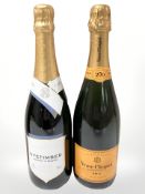 A bottle of Nyetimber classic cuvee, 750 ml, and a bottle Veuve Cliquot brut champagne, 750 ml.