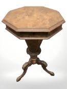 A walnut octagonal tripod work table,