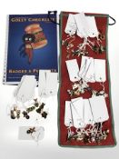 A collection of Robertson's golly pin badges.