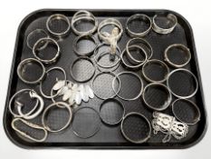 A large quantity of silver, Continental silver bangles, 903g.