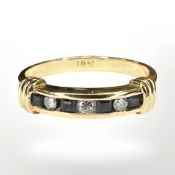 An 18ct yellow gold diamond and square cut sapphire ring, size Q.