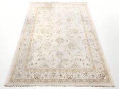 A machine made rug of Zeigler design, 237 cm x 170 cm.