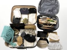Assorted lady's evening bags, oriental hand fans, etc, contained in two small luggage cases.