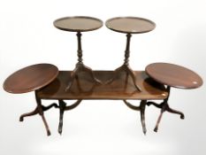 A reproduction rectangular inlaid mahogany table and two pairs of wine tables.