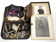 A pair of binoculars, radio operators headphones, assorted miliary buttons,