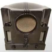 An Art Deco Bakelite valve radio, width 35 cm.