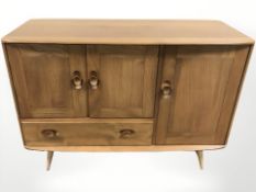 An Ercol elm sideboard, 115 cm W x 49 cm D x 82 cm H.