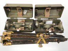 A tripod, a surveyor's level and two cases containing Kern surveyor's targets.