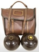 A set of four Thomas Taylor Glasgow lawn bowls, size 5, in carry bag.