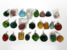 Twenty-four silver-mounted semi-precious stone pendants set with large, coloured gemstones,
