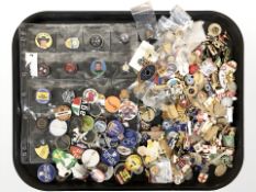 A large quantity of badges and lapel pins.