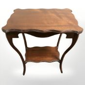 An Edwardian mahogany side table,