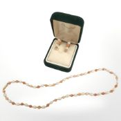 A coral and pearl necklace studded in 9ct gold, length 40 cm,