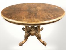 A Victorian figured walnut and satinwood inlaid oval occasional table, width 93 cm.