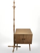 A 20th century teak double door record cabinet on splayed legs, together with a hat and coat stand.