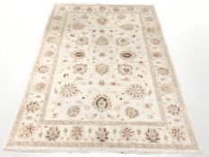 A machine made rug of Zeigler design, 237 cm x 170 cm.