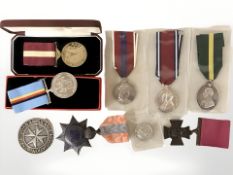 A group of medals comprising a George V Territorial Force Efficiency medal named to T4/249811 DVR.