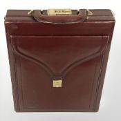 A stitched Burgundy leather satchel