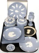 A group of Wedgwood blue and black Jasper ware dishes, trinket boxes and covers, vase,