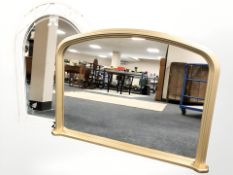 A modern gilt overmantel mirror, width 107 cm, and a painted wrought metal mirror.