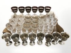 A set of six ruby flash champagne glasses, further crystal drinking glasses and pewter tankards.