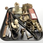 A brass and onyx table lighter and matching ashtray, pipes, folding knives, miniature brass cannon,