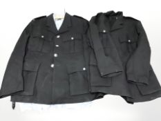 Two Police tunics and a shirt.