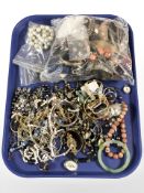 Assorted costume bracelets, bangles, necklaces, a Chinese nephrite bangle, simulated pearls, etc.