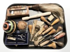 A group of dominoes, pastry cutter and other utensils, African fly swish, etc.