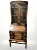 An Edwardian glazed oak bureau bookcase,
