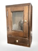 A stained pine smokers cabinet, height 31 cm.