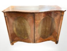 A George III satinwood serpentine commode, 127 cm W x 61 cm D x 87 cm H.