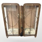 A 1920's walnut chinoiserie double door display cabinet, 107 cm W x 33 cm D x 118 cm H.