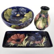 Three items of Moorcroft pottery, tray 20 cm wide.