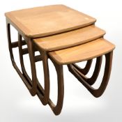 A nest of three teak tables,
