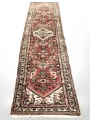 A Hamadan runner, North-West Iran, 313 cm x 87 cm.