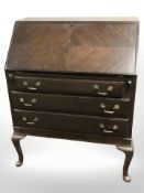 A mahogany fall front bureau on pad feet,
