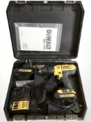 A Dewalt drill in case with instructions