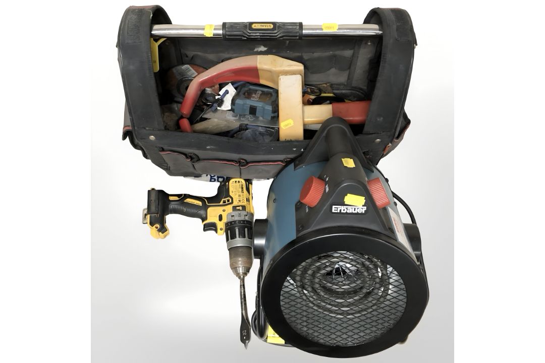 A Stanley tool bag containing various tools, Dewalt drill,