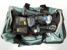 A Makita tool bag containing angle grinder, torch, drill,