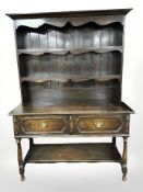 A late Victorian stained oak dresser,