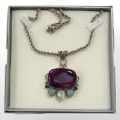 A sterling silver necklace with pink agate pendant