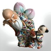 A Chinese famille rose porcelain longevity figure, height 23 cm.