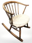 An Ercol stained elm rocking chair