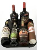 Six bottles of alcohol including Tia Maria, Four Bells navy rum, Bols apricot brandy, etc.