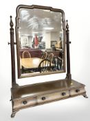 An early 20th century mahogany bevelled dressing table mirror, fitted three drawers,