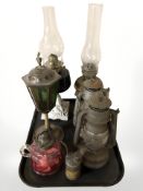 Six various oil lamps and a Primus oil dispensing can.
