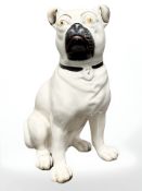 A Victorian Staffordshire pottery seated pug, height 27.5 cm.