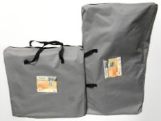 An Adventuridge camping kitchen and cupboard in carry bags